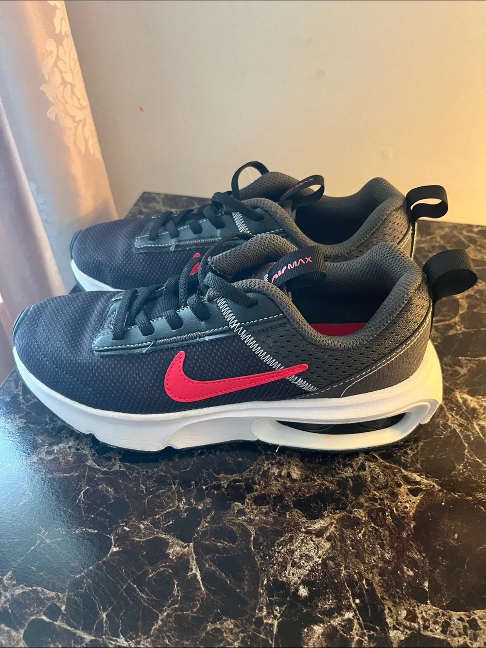Nike Kids Black Sneakers with Red Swoosh and White Air Sole